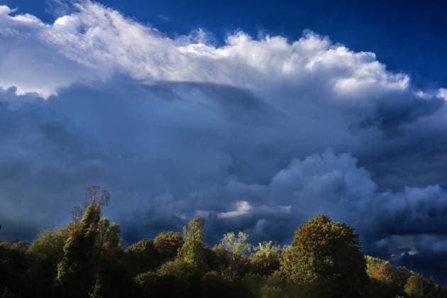 Moments Before a Thunderstorm: A thundercloud reveals itself in all its grandeur and maturity shortly after the start of meteorological fall, just a few minutes before a powerful thunderstorm in Essen, North Rhine-Westphalia, Germany