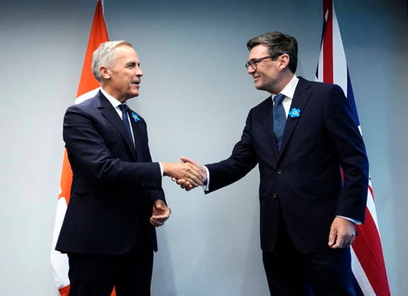 September 16, 2026, Liverpool, United Kingdom: Prime Minister Mark Carney, left, shakes hands with British Prime Minister Andy Burnham at Hill Dickinson Stadium in Liverpool, England, on Wednesday, Sept. 16, 2026. Liverpool United Kingdom  - ZUMAc35_ 20260916_zaf_c35_101 Copyright: xJustinxTangx