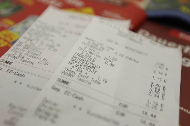 Two receipts are lying on flyers from various discount stores. Stock photo. Symbolic image. Inflation. Schnelsen, Hamburg