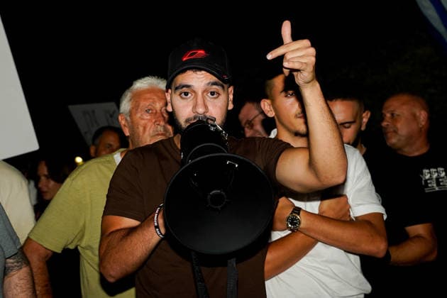 Protest against the filmmakers of NAZA in Savyon, Israel - 16 SEP 2026. Right-wing activist, Mordechai David seen speaking through a megaphone during a protest against the filmmakers of NAZA. Right-wing activists and their supporters protest outside the home of the parents of Rachel Szor, co-director of NAZA, which was awarded the Special Jury Prize at the 83rd Venice International Film Festival on September 12. The demonstration was led by right-wing activists Ziv Baraness and Mordechai David, who are involved in the election campaign of Itamar Ben Gvirís Otzma Yehudit party. Protesters criticized the filmís content, alleging that testimonies featured in it contain blatant falsehoods and claiming that the film contributes to antisemitism Copyright: xSharonxEilonx xSOPAxImagesx Sharon_Eilon-342