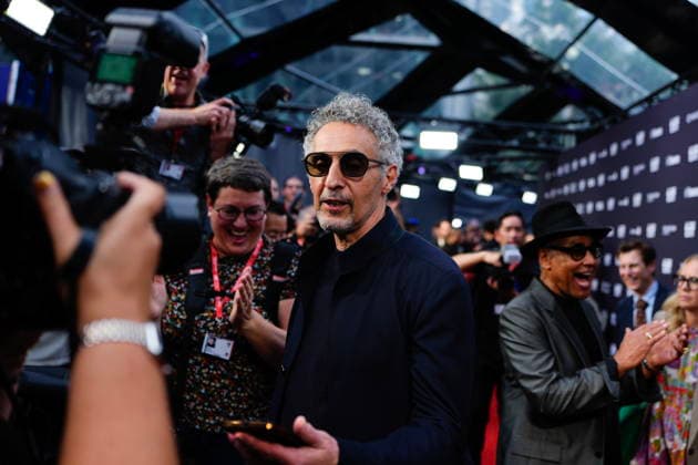 September 16, 2026, Toronto, On, CAN: John Turturro produces a phone he had taken out of a photographer s pocket as Giancarlo Esposito reacts on the red carpet to promote the film The Only Living Pickpocket in New York at the Toronto International Film Festival, in Toronto, on Wednesday Sept.16, 2026, Toronto CAN  - ZUMAc35_ 20260916_zaf_c35_271 Copyright: xChrisxYoungx