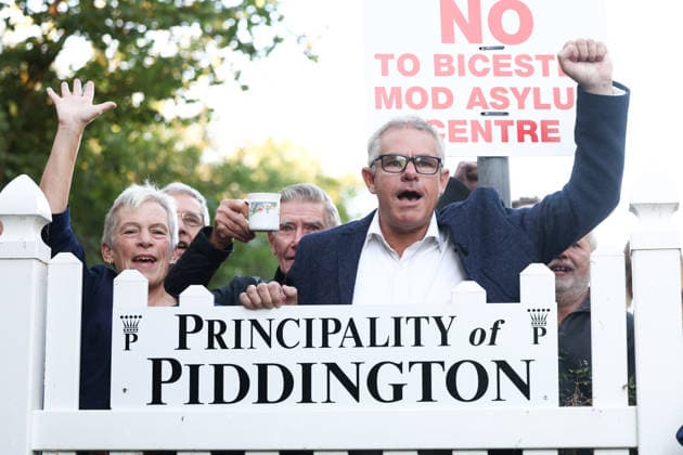 Piddington Referendem 16.09.2026. The village of Piddington votes to symbolically leave the UK in protest against a nearby asylum centre. Residents celebrate by renaming Piddington to the Principality of Piddington  Copyright: xTobyxShepheardx NINTCHDBPICT001108848279
