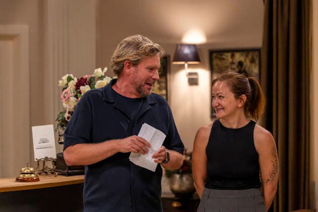 September 16, 2026, ARD telenovela *STURM DER LIEBE*, photo shoot for Season 23 on the film set in Munich, at Bavaria Film in Geiselgasteig, in the studio set of the fictional Hotel Fürstenhof. The new season premieres on November 4, 2026. From left: Producer Peter Proske Clayton with editor Lara Okamoto at the reception desk on