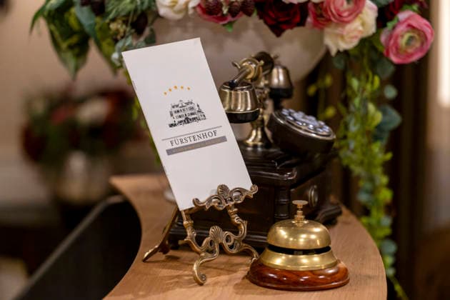 September 16, 2026, ARD telenovela *Storm of Love*, photo shoot for Season 23 on the film set in Munich, at Bavaria Film in Geiselgasteig, in the studio set of the fictional Hotel Fürstenhof reception area with a telephone and doorbell, September 16, 2026, ARD series *Sturm der Liebe* September 16, 2026, ARD series *Sturm der Liebe*