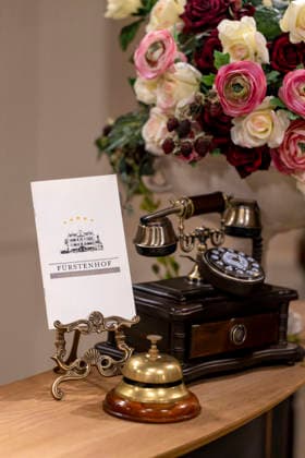 September 16, 2026, ARD telenovela *Sturm der Liebe*, photo shoot for Season 23 on the film set in Munich, at Bavaria Film in Geiselgasteig, in the studio set of the fictional Hotel Fürstenhof reception area with a telephone and doorbell, September 16, 2026, ARD series *Sturm der Liebe* September 16, 2026, ARD series *Sturm der Liebe*