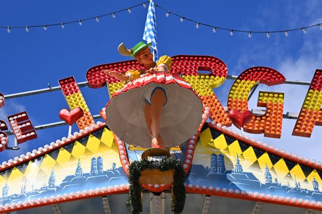 A scantily clad female figure, a doll in a maze ride, a carnival performer, and a press tour of the rides ahead of the 191st Oktoberfest in 2026 on September 17, 2026