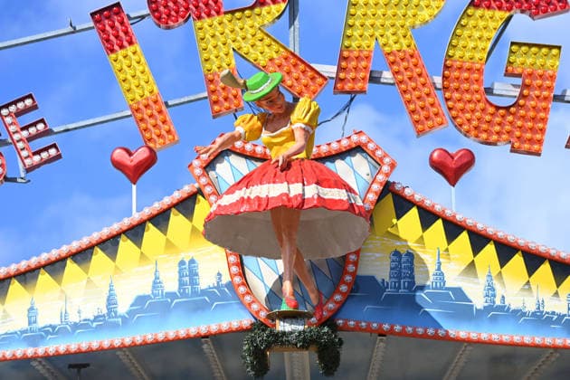 A sensually posed female figure, a doll in a maze ride, a carnival operator, and a press tour of the rides ahead of the 191st Oktoberfest in 2026 on September 17, 2026