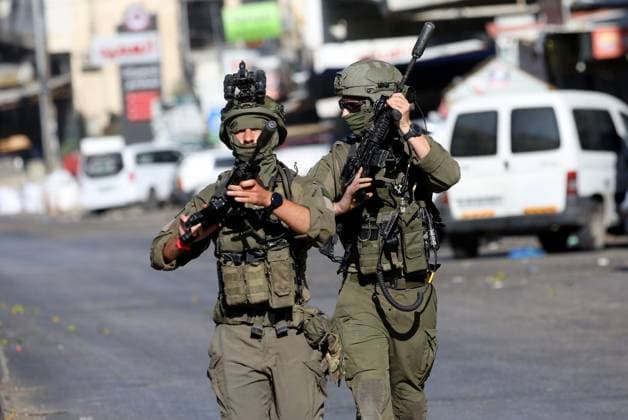 September 17, 2026, Nablus, Palestine, State of: NABLUS, OCCUPIED WEST BANK, SEPTEMBER 17, 2026: Israeli troops move along a street during a military operation in Ein Beit al-Ma refugee camp, west of Nablus in the occupied West Bank. Nablus Palestine, State of - ZUMAq101 20260917_zna_q101_020 Copyright: xNedalxShtiehx