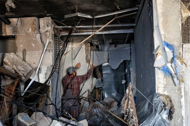 A worker removes unsafe internal partitions inside an apartment destroyed by a nighttime Russian drone strike on a 19-storey block of flats in Odesa, Ukraine, September 17, 2026. Ten apartments between the 14th and 16th floors sustained significant damage. Three people, including a four-year-old child, were injured. (Photo by Nina Liashonok Ukrinform) Overnight Russian attack damages 19-storey apartment block in Odesa  Copyright: xNinaxLiashonokx