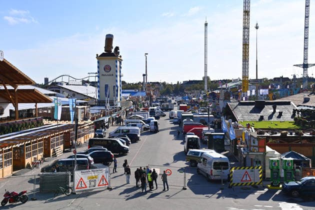 The festival grounds are bustling with activity: cars and trucks, amusement rides, carnival operators, and rides. Press tour ahead of the 191st Oktoberfest in 2026 on September 17, 2026.