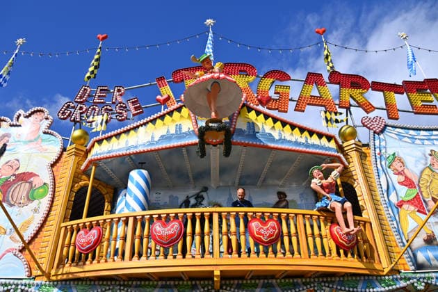A scantily clad female figure, a doll in a maze ride, a carnival operator, and a press tour of the rides ahead of the 191st Oktoberfest in 2026 on September 17, 2026