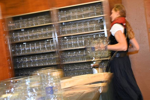 Beer mugs are unpacked and placed on shelves. Female waitress, server. Press tour ahead of the 191st Oktoberfest 2026 on September 17, 2026