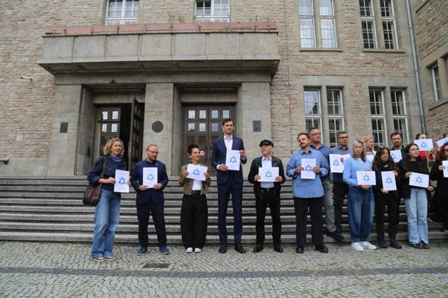 Berlin, Germany, September 17, 2026: District Mayor Martin Hikel and staff members of the Neukölln District Office participate in the Berlin Wears the Star of David campaign in front of Neukölln City Hall. Participants hold posters featuring the Star of David with the slogans We Protect Jewish Life, Against All Fo Copyright: xAlonxDavidx
