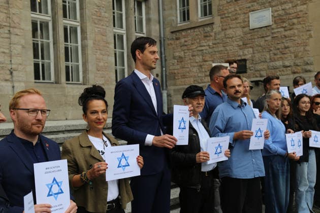 Berlin, Germany, September 17, 2026: District Mayor Martin Hikel and staff members of the Neukölln District Office participate in the Berlin Wears the Star of David campaign in front of Neukölln City Hall. Participants hold posters featuring the Star of David with the slogans We Protect Jewish Life, Against All Fo Copyright: xAlonxDavidx