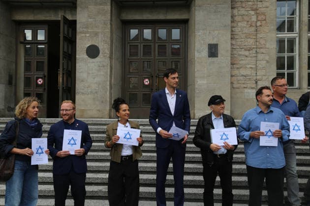 Berlin, Germany, September 17, 2026: District Mayor Martin Hikel and staff members of the Neukölln District Office participate in the Berlin Wears the Star of David campaign in front of Neukölln City Hall. Participants hold posters featuring the Star of David with the slogans We Protect Jewish Life, Against All Fo Copyright: xAlonxDavidx