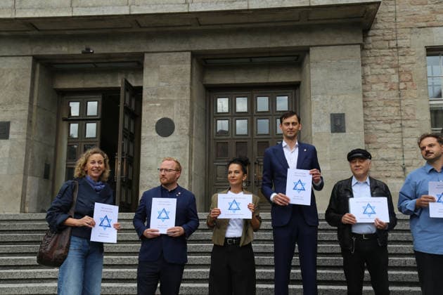 Berlin, Germany, September 17, 2026: District Mayor Martin Hikel and staff members of the Neukölln District Office participate in the Berlin Wears the Star of David campaign in front of Neukölln City Hall. Participants hold posters featuring the Star of David with the slogans We Protect Jewish Life, Against All Fo Copyright: xAlonxDavidx