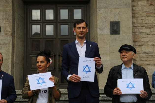 Berlin, Germany, September 17, 2026: District Mayor Martin Hikel and staff members of the Neukölln District Office participate in the Berlin Wears the Star of David campaign in front of Neukölln City Hall. Participants hold posters featuring the Star of David with the slogans We Protect Jewish Life, Against All Fo Copyright: xAlonxDavidx