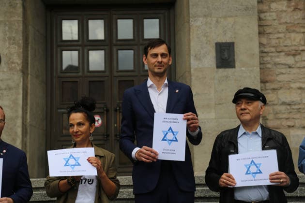 Berlin, Germany, September 17, 2026: District Mayor Martin Hikel and staff members of the Neukölln District Office participate in the Berlin Wears the Star of David campaign in front of Neukölln City Hall. Participants hold posters featuring the Star of David with the slogans We Protect Jewish Life, Against All Fo Copyright: xAlonxDavidx
