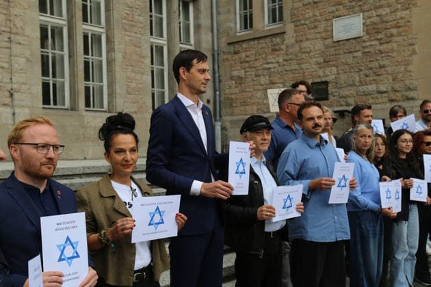Berlin, Germany, September 17, 2026: District Mayor Martin Hikel and staff members of the Neukölln District Office participate in the Berlin Wears the Star of David campaign in front of Neukölln City Hall. Participants hold posters featuring the Star of David with the slogans We Protect Jewish Life, Against All Fo Copyright: xAlonxDavidx