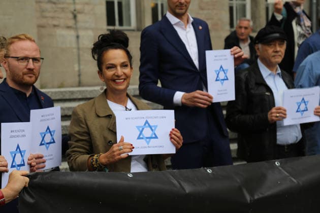 Berlin, Germany, September 17, 2026: District Mayor Martin Hikel and staff members of the Neukölln District Office participate in the Berlin Wears the Star of David campaign in front of Neukölln City Hall. Participants hold posters featuring the Star of David with the slogans We Protect Jewish Life, Against All Fo Copyright: xAlonxDavidx