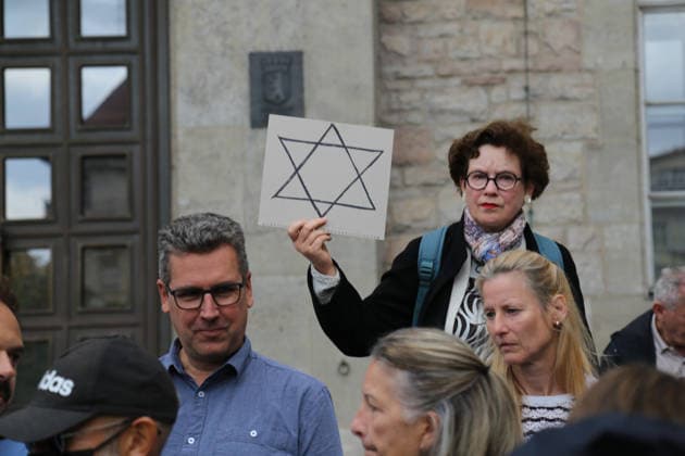Berlin, Germany, September 17, 2026: Participants in the Berlin Wears the Star of David solidarity event in front of Neukölln City Hall display Stars of David and posters reading We Protect Jewish Life—Against All Forms of Anti-Semitism, Star of David, solidarity, Jewish community, Jewish life, Judaism, anti-Semitism, a stand a Copyright: xAlonxDavidx
