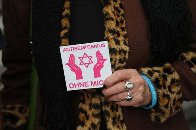 Berlin, Germany, September 17, 2026. Close-up of a participant in the solidarity event Berlin Wears the Star of David wearing a sticker that reads Anti-Semitism: Not Me and the Star of David. On her wrist, she wears a bracelet inscribed with the words Israel Lives. Anti-Semitism, against anti-Se Copyright: xAlonxDavidx