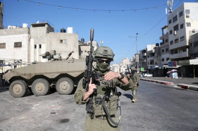 September 17, 2026, Nablus, Palestine: An Israeli soldier takes position near armored Israeli military vehicles blocking the main road at the entrance to the Al-Ain refugee camp, west of Nablus in the West Bank, during an Israeli military operation to search for combat materials. Residents reported that the army raided and searched homes and arrested five people, and some people were injured after being severely beaten. Nablus Palestine - ZUMAs197 20260917_aaa_s197_042 Copyright: xNasserxishatyehx