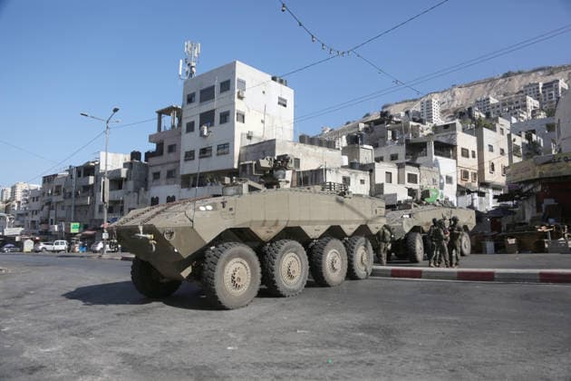 September 17, 2026, Nablus, Palestine: Armored Israeli military vehicles block the main road at the entrance to the Al-Ein refugee camp, west of Nablus in the West Bank, during an Israeli military operation to search for combat materials. Residents reported that the army raided and searched homes and arrested five people, and some people were injured after being severely beaten. Nablus Palestine - ZUMAs197 20260917_aaa_s197_039 Copyright: xNasserxishatyehx
