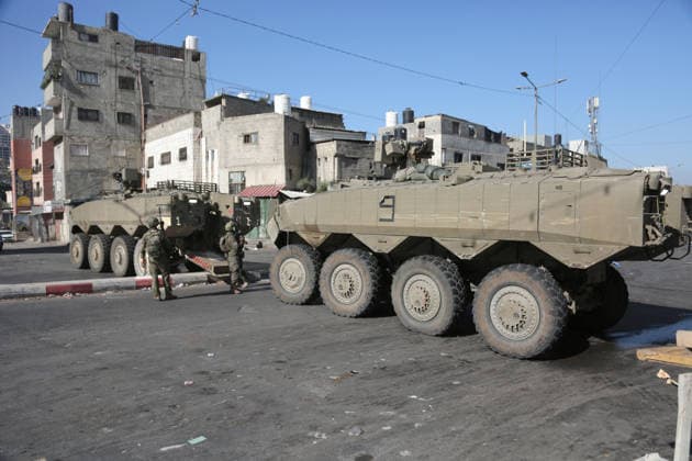 September 17, 2026, Nablus, Palestine: Armored Israeli military vehicles block the main road at the entrance to the Al-Ein refugee camp, west of Nablus in the West Bank, during an Israeli military operation to search for combat materials. Residents reported that the army raided and searched homes and arrested five people, and some people were injured after being severely beaten. Nablus Palestine - ZUMAs197 20260917_aaa_s197_047 Copyright: xNasserxishatyehx