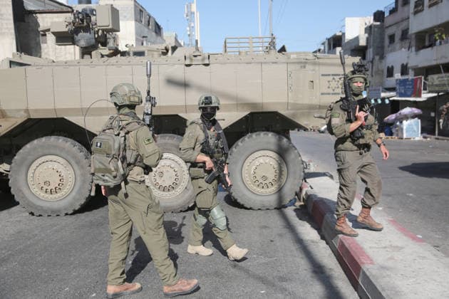 September 17, 2026, Nablus, Palestine: Israeli soldiers take positions near armored Israeli military vehicles blocking the main road at the entrance to the Al-Ain refugee camp, west of Nablus in the West Bank, during an Israeli military operation to search for combat materials. Residents reported that the army raided and searched homes and arrested five people, and some people were injured after being severely beaten. Nablus Palestine  - ZUMAs197 20260917_aaa_s197_050 Copyright: xNasserxishatyehx
