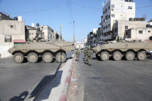 September 17, 2026, Nablus, Palestine: Armored Israeli military vehicles block the main road at the entrance to the Al-Ein refugee camp, west of Nablus in the West Bank, during an Israeli military operation to search for combat materials. Residents reported that the army raided and searched homes and arrested five people, and some people were injured after being severely beaten. Nablus Palestine - ZUMAs197 20260917_aaa_s197_044 Copyright: xNasserxishatyehx