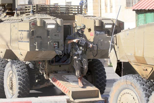 September 17, 2026, Nablus, Palestine: An Israeli soldier carrying a tear-gas rifle exits an armored Israeli military vehicle blocking the main road at the entrance to the Ein refugee camp, west of Nablus in the West Bank, during an Israeli military operation to search for weapons. Residents reported that the army raided and searched homes and arrested five people, and some people were injured after being severely beaten. Nablus Palestine  - ZUMAs197 20260917_aaa_s197_065 Copyright: xNasserxishatyehx