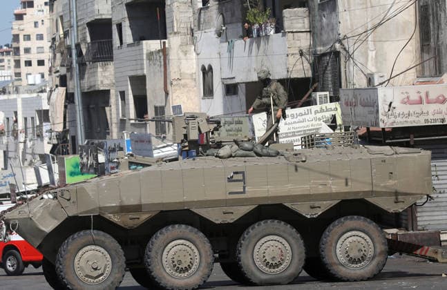 September 17, 2026, Nablus, Palestine: An Israeli soldier takes position atop an armored military vehicle during an Israeli military operation targeting residents of the Ein refugee camp, west of Nablus in the West Bank, to search for weaponry. Residents reported that the army raided and searched homes and arrested five people, and some people were injured after being severely beaten. Nablus Palestine - ZUMAs197 20260917_aaa_s197_054 Copyright: xNasserxishatyehx