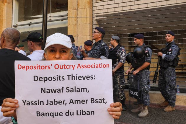 September 17, 2026, Beirut, Beirut, Lebanon: A depositor displays a banner denouncing Lebanese Prime Minister Nawaf Salam, Minister of Economy Amer Bsat, Minister of Finance Yassin Jaber and LebanonÃ¢â‚¬â ¢s central bank during a protest in front of the ministry of Economy in Beirut during a protest by investors who are still unable to withdraw their foreign-currency savings. Depositors called on the government and Parliament to adopt a fair plan to recover their funds. Demonstrators clashed with security forces guarding a bank leaving several people injured among the protesters. Beirut Lebanon  - ZUMAn313 20260917_zip_n313_009 Copyright: xMarwanxNaamanix