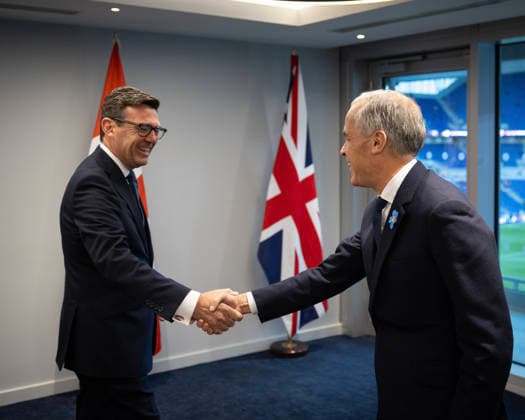 Prime Minister Mark Carney ( L) shakes hands with British Prime Minister Andy Burnham at Hill Dickinson Stadium in Liverpool, England, on Wednesday, Sept. 16, 2026.  FRN2026091721 CanadianxPresidency