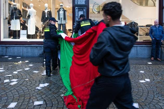 AMSTERDAM - A Palestinian flag is confiscated during a national demonstration on Dam Square by the working group Op de Bres voor IsraÃ«l, together with other organizations. A counter-demonstration has also been announced. DINGENA MOL ANP netherlands out - belgium out  Copyright: xx x569001625x originalFilename: 569001625.jpg