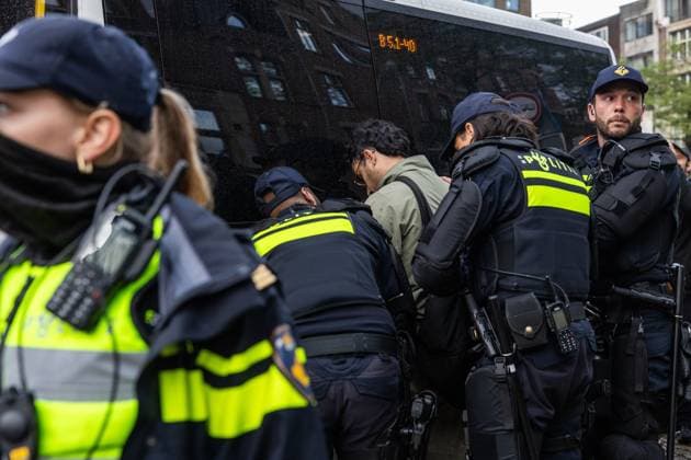 AMSTERDAM - Pro-Palestine demonstrator is searched during a national rally on Dam Square organized by the working group Op de Bres voor IsraÃ«l together with other organizations. A counter-demonstration has also been announced. DINGENA MOL ANP netherlands out - belgium out  Copyright: xx x569002265x originalFilename: 569002265.jpg