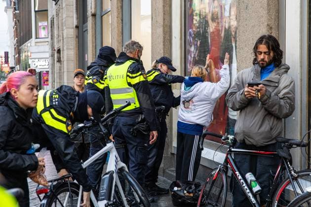 AMSTERDAM - Woman is searched during a national demonstration on Dam Square organized by the working group Op de Bres voor IsraÃ«l together with other organizations. A counter-demonstration has also been announced. DINGENA MOL ANP netherlands out - belgium out  Copyright: xx x569010254x originalFilename: 569010254.jpg