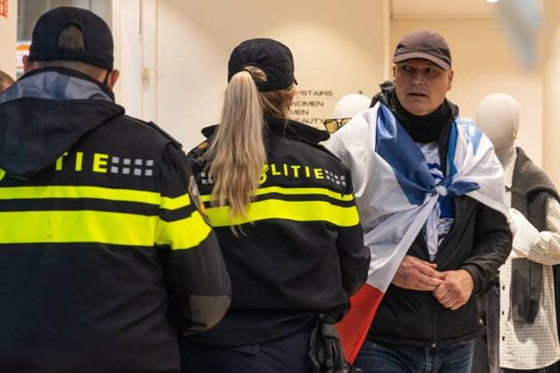 AMSTERDAM - A man in H&M during a national demonstration on Dam Square organized by the working group Op de Bres voor IsraÃ«l together with other organizations. A counter-demonstration has also been announced. DINGENA MOL ANP netherlands out - belgium out  Copyright: xx x569010410x originalFilename: 569010410.jpg