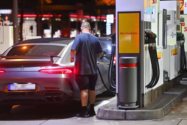 High Gas Prices Are Approaching an All-Time High Featured Image: Gas Prices; Gas Prices Are Driving Inflation; Gas Station in the Evening; A Man Fills Up His Car, Standing at a Gas Pump on the Mittlerer Ring in Munich on September 17, 2026