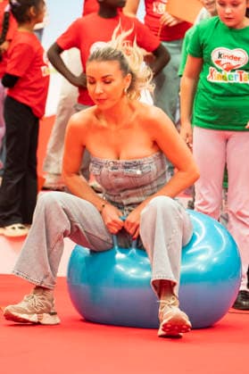 ABB CHILDREN S DAY Anna Carina Woitschack sits on a bouncy ball at Children s Day at the Atelier Gardens in Berlin on September 17, 2026