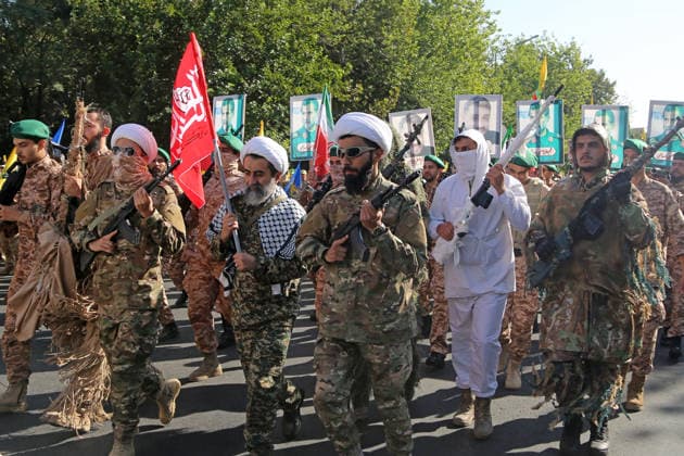 Armed volunteers march through central Tehran in Basij-led mobilization rally TEHRAN, IRAN - SEPTEMBER 18: (RESTRICTIONS: No Access Israel Media Persian Language TV Stations Outside Iran Strictly No Access BBC Persian VOA Persian Manoto TV Iran International TV) Armed volunteers registered with the Janfada-ye Iran program march between Imam Hossein Square and Enqelab Square in Tehran, Iran on September 18, 2026. Led by the Basij paramilitary force affiliated with the Islamic Revolutionary Guard Corps (IRGC), demonstrators carrying automatic rifles and long-barrel weapons took to the streets to demonstrate wartime mobilization and national defense readiness following recent US and Israeli strikes. Fatemeh Bahrami Anadolu Tehran Iran. Ed  Copyright: x2026xAnadoluxFatemehxBahramix