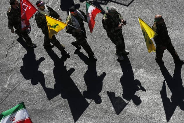 Armed volunteers march through central Tehran in Basij-led mobilization rally TEHRAN, IRAN - SEPTEMBER 18: (RESTRICTIONS: No Access Israel Media Persian Language TV Stations Outside Iran Strictly No Access BBC Persian VOA Persian Manoto TV Iran International TV) Armed volunteers registered with the Janfada-ye Iran program march between Imam Hossein Square and Enqelab Square in Tehran, Iran on September 18, 2026. Led by the Basij paramilitary force affiliated with the Islamic Revolutionary Guard Corps (IRGC), demonstrators carrying automatic rifles and long-barrel weapons took to the streets to demonstrate wartime mobilization and national defense readiness following recent US and Israeli strikes. Fatemeh Bahrami Anadolu Tehran Iran. Ed  Copyright: x2026xAnadoluxFatemehxBahramix