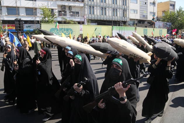 Armed volunteers march through central Tehran in Basij-led mobilization rally TEHRAN, IRAN - SEPTEMBER 18: (RESTRICTIONS: No Access Israel Media Persian Language TV Stations Outside Iran Strictly No Access BBC Persian VOA Persian Manoto TV Iran International TV) Armed volunteers registered with the Janfada-ye Iran program march between Imam Hossein Square and Enqelab Square in Tehran, Iran on September 18, 2026. Led by the Basij paramilitary force affiliated with the Islamic Revolutionary Guard Corps (IRGC), demonstrators carrying automatic rifles and long-barrel weapons took to the streets to demonstrate wartime mobilization and national defense readiness following recent US and Israeli strikes. Fatemeh Bahrami Anadolu Tehran Iran. Ed  Copyright: x2026xAnadoluxFatemehxBahramix