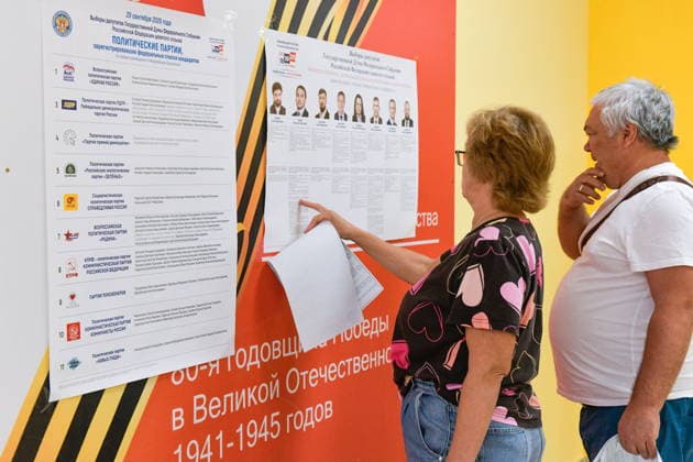 RUSSIA, KRASNODAR - SEPTEMBER 18, 2026: Voters read an election candidate list at a polling station during the 2026 Russian legislative election. From September 18 to 20, Russia holds regional parliamentary elections, alongside the election of members to the Russian State Duma (the lower house of the Russian parliament) Krasnodar Russia  - ZUMAt113 20260918_zaa_t113_430 Copyright: xRomanxSokolovx