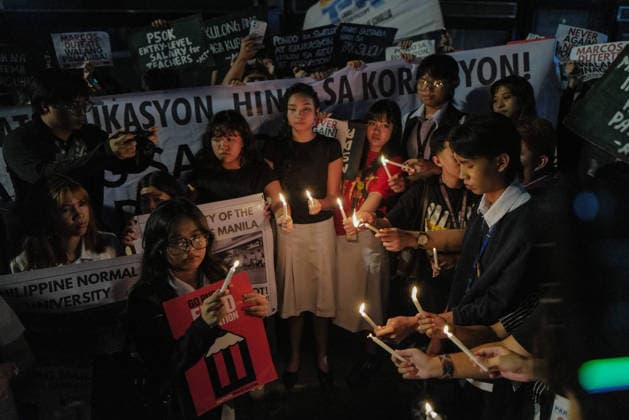 September 18, 2026, Philippines: Students from La Salle along with One Taft, a coalition of Taft-based schools, light candles to end the program of the Black Friday Protest on Friday at Taft Ave, Metro Manila. It coincided with the Black Friday Protests from different universities and a preparation for the mass movement on Sept. 21 for the Martial Law anniversary. Among the calls were for the alleged human rights abuses, corruption, and the Pax Silica initiative under the administration of President Ferdinand Marcos Jr. Philippines - ZUMAr240 20260918_zip_r240_043 Copyright: xMarcxDominicxRostratax