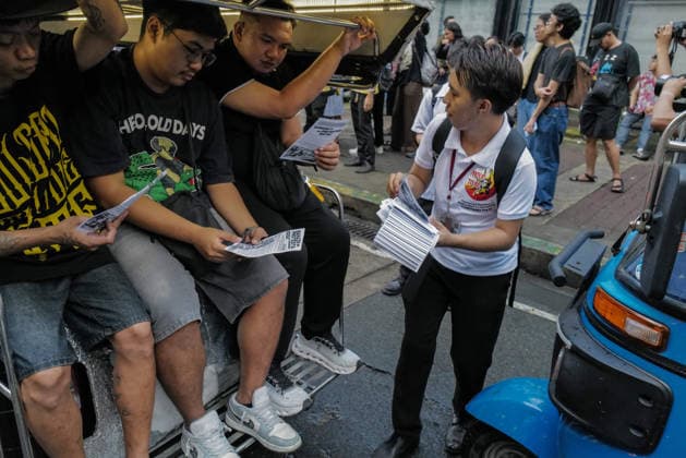 September 18, 2026, Philippines: A student giving pamphlets to commuters during the Black Friday Protest on Friday at Taft Ave, Metro Manila. It coincided with the Black Friday Protests from different universities and a preparation for the mass movement on Sept. 21 for the Martial Law anniversary. Among the calls were for the alleged human rights abuses, corruption, and the Pax Silica initiative under the administration of President Ferdinand Marcos Jr. Philippines - ZUMAr240 20260918_zip_r240_031 Copyright: xMarcxDominicxRostratax