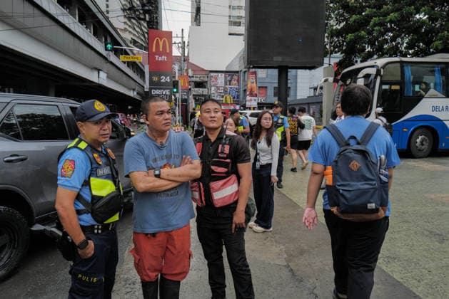 September 18, 2026, Philippines: La Salle securities and police talk with each other during the Black Friday Protest on Friday at Taft Ave, Metro Manila. It coincided with the Black Friday Protests from different universities and a preparation for the mass movement on Sept. 21 for the Martial Law anniversary. Among the calls were for the alleged human rights abuses, corruption, and the Pax Silica initiative under the administration of President Ferdinand Marcos Jr. Philippines  - ZUMAr240 20260918_zip_r240_021 Copyright: xMarcxDominicxRostratax