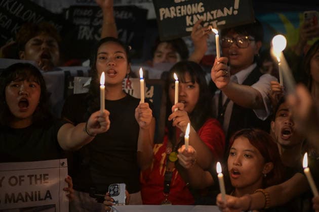 September 18, 2026, Philippines: Students from La Salle along with One Taft, a coalition of Taft-based schools, light candles to end the program of the Black Friday Protest on Friday at Taft Ave, Metro Manila. It coincided with the Black Friday Protests from different universities and a preparation for the mass movement on Sept. 21 for the Martial Law anniversary. Among the calls were for the alleged human rights abuses, corruption, and the Pax Silica initiative under the administration of President Ferdinand Marcos Jr. Philippines - ZUMAr240 20260918_zip_r240_018 Copyright: xMarcxDominicxRostratax
