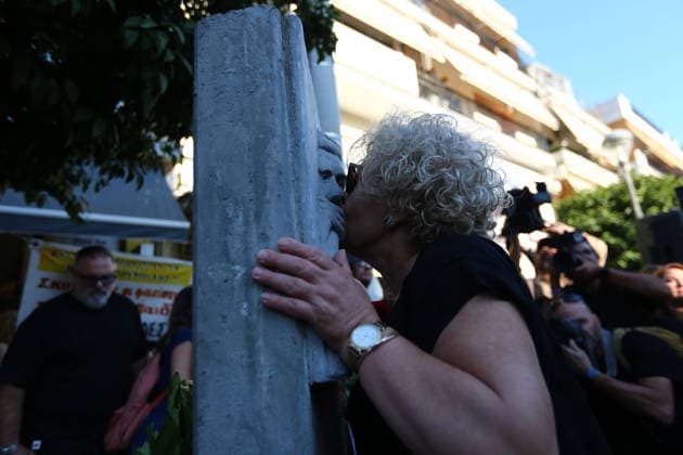September 18, 2026, Keratsini, Attica, GREECE: Magda Fyssa, mother of murdered anti-fascist musician Pavlos Fyssas, kisses the memorial of her son during a gathering marking the 13th anniversary of his murder in Keratsini, near Athens, Greece, September 18, 2026. Keratsini GREECE - ZUMAx103 20260918_zip_x103_002 Copyright: xHarrisxXanthopoulosx